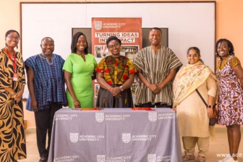 Team members from Academic City and Arima Resources in a group photograph.